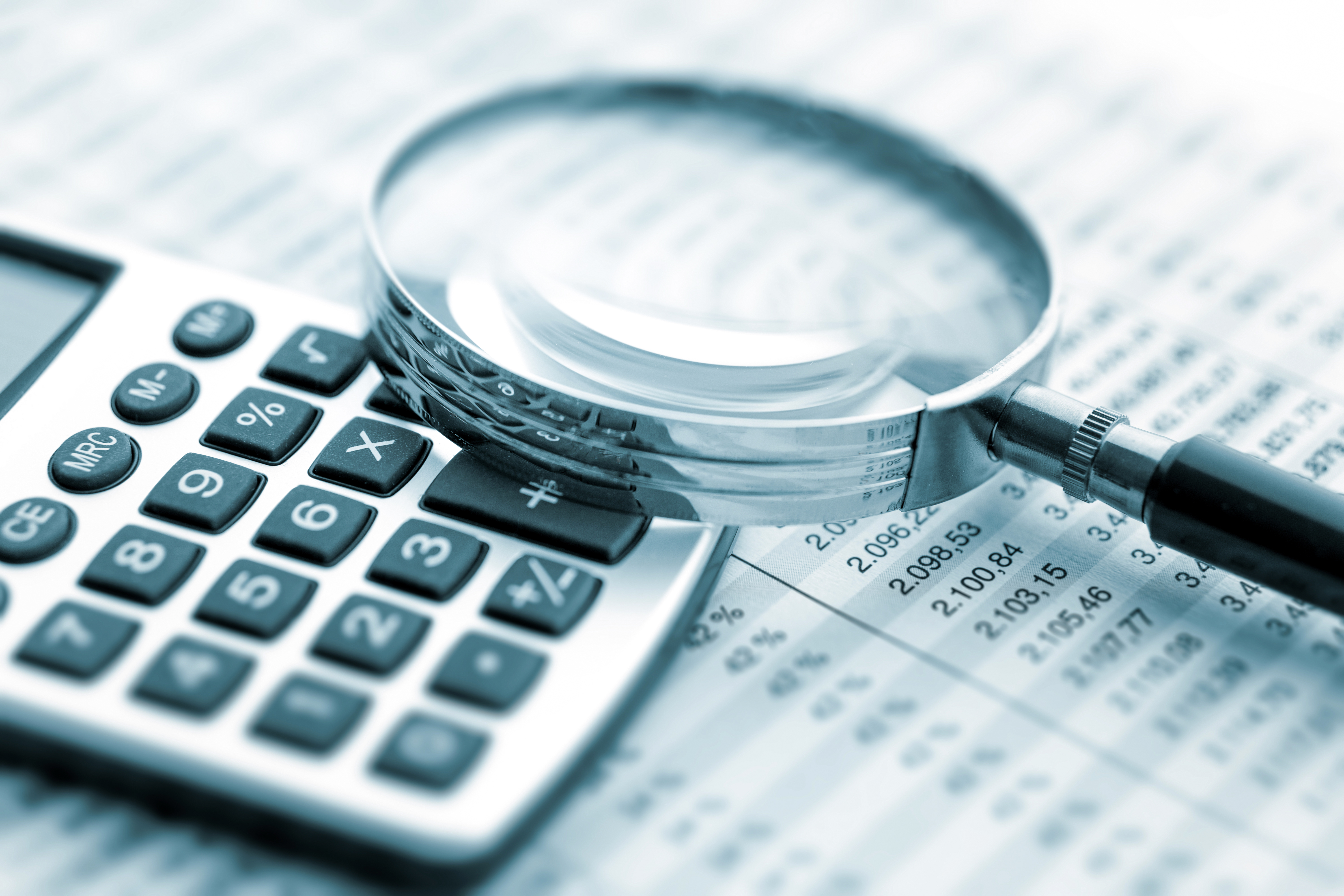 Calculator and documents representing structured compliance review