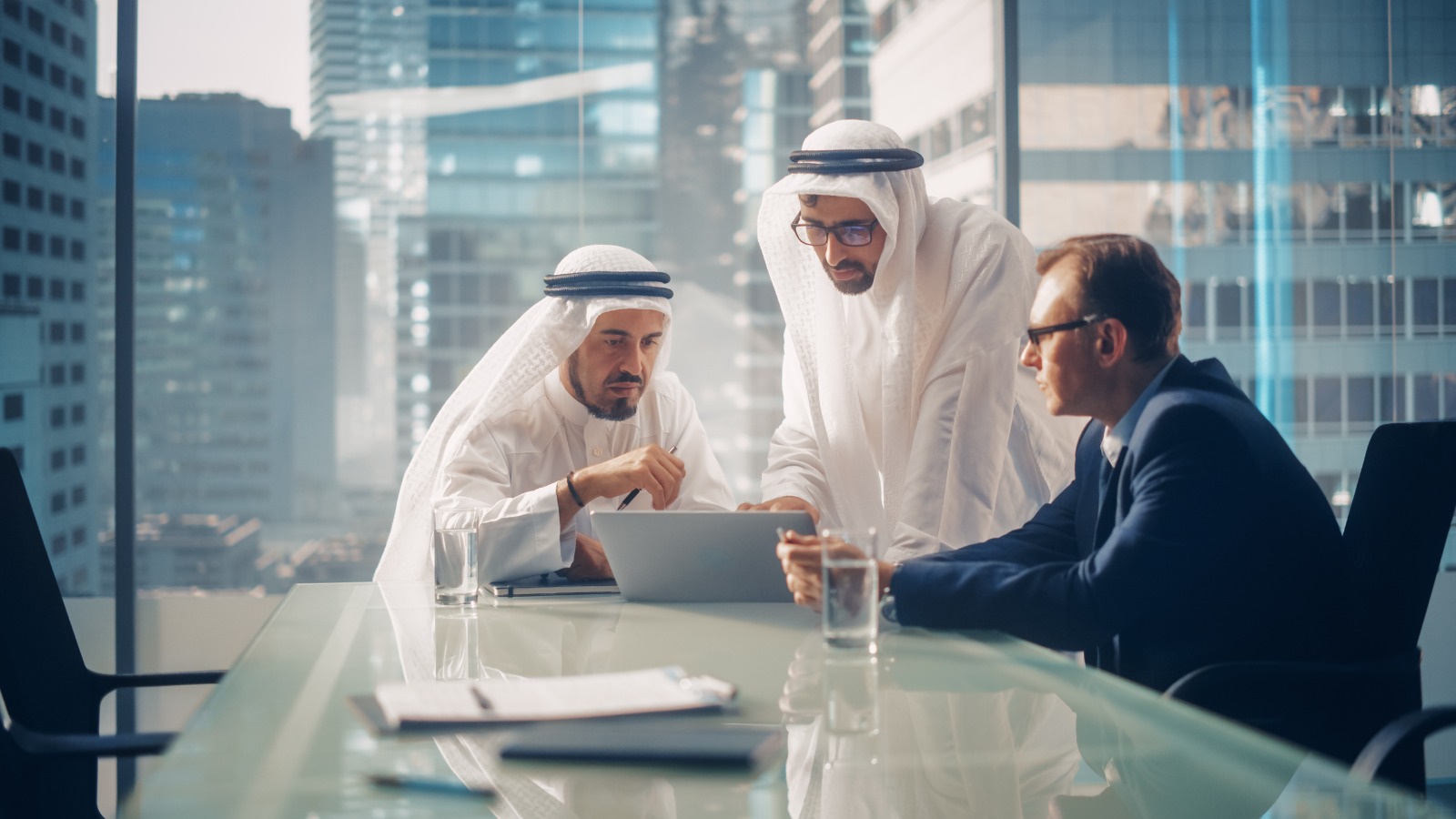 Corporate advisors reviewing work in a meeting