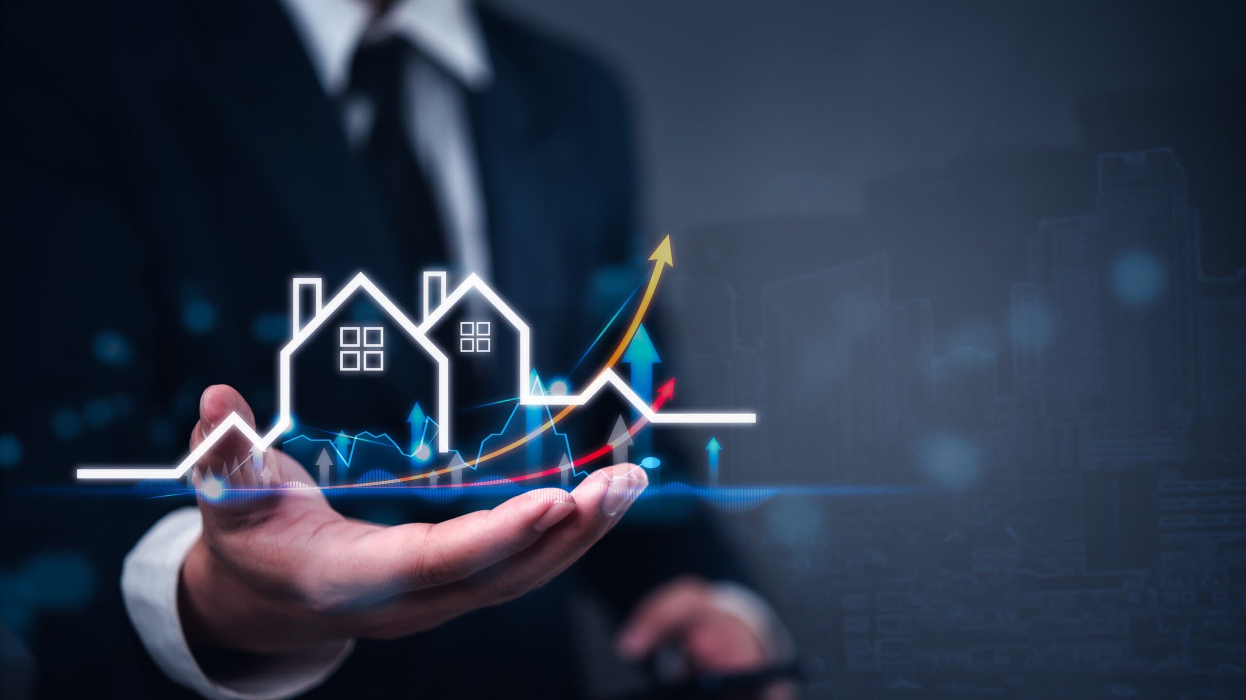 Real estate growth graphic over an advisor's hand