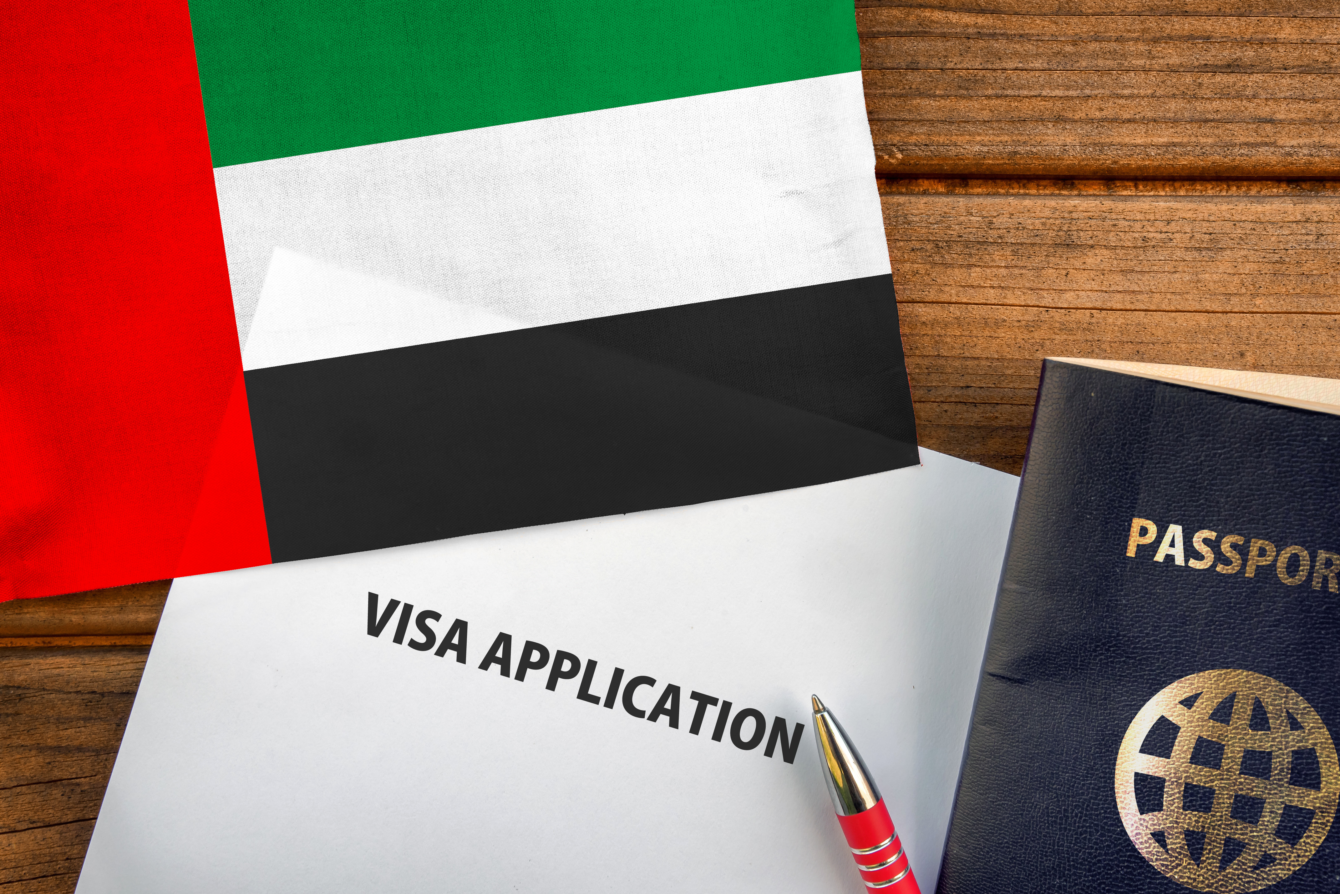 Visa application materials with UAE flag details